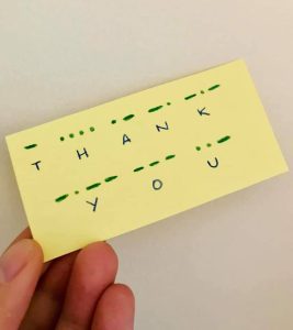 A post it note saying thank you